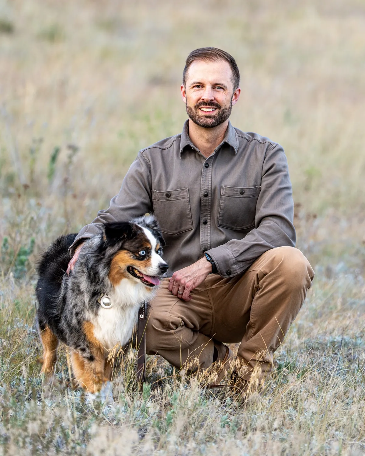 Tyler Marshall, MA, LPCC, with his dog in the Colorado foothills